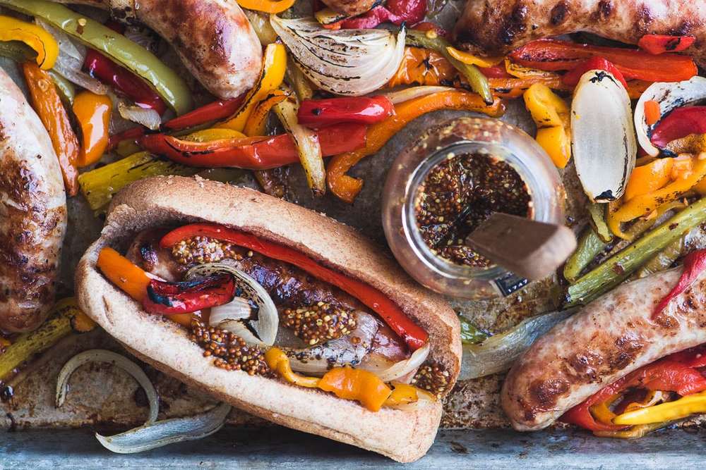 Sheet Pan Peppers and Brats Recipe | HeyFood — heyfoodapp.com