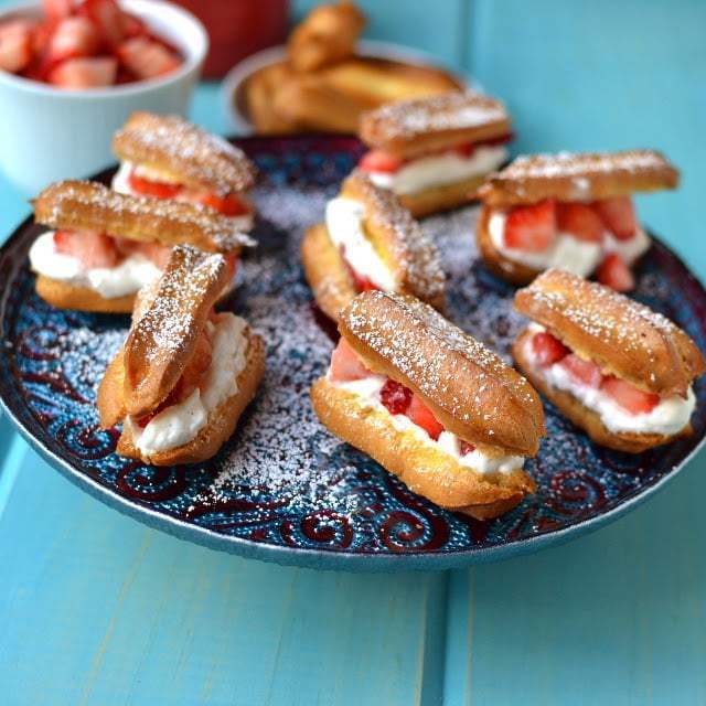 Mini Éclairs with Strawberries & Cream Recipe | HeyFood — heyfoodapp.com