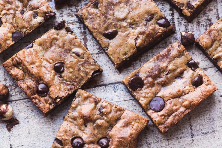 Outrageous Chocolate Hazelnut Blondies Recipe | HeyFood — heyfoodapp.com