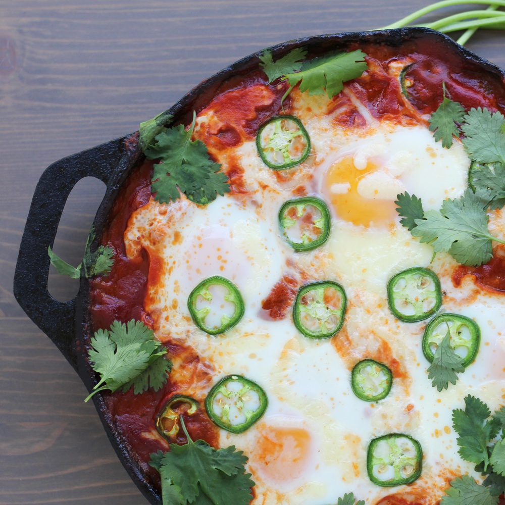 Eggs Baked In Tomatoes With Cheese, Cilantro, And Jalapeno Pepper Recipe | HeyFood — heyfoodapp.com