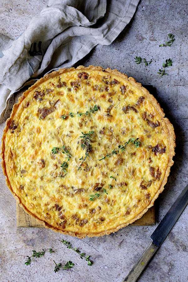 Caramelized Onion and Goat Cheese Tart with Thyme Recipe | HeyFood — heyfoodapp.com