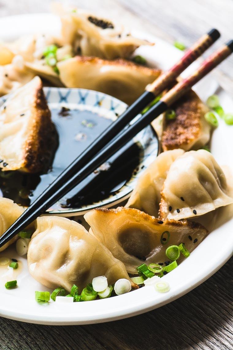 Japanese Pork Dumplings with Ginger and Green Onion Recipe | HeyFood — heyfoodapp.com