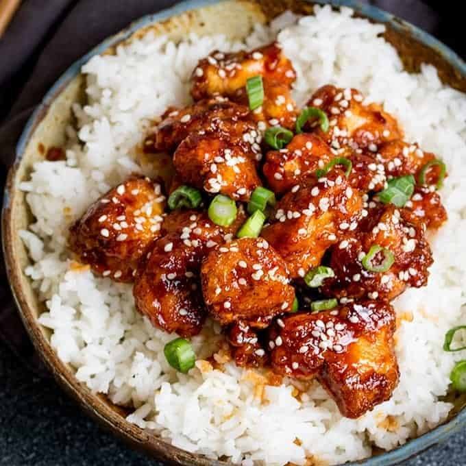 Crispy Sesame Chicken With A Sticky Asian Sauce Recipe | HeyFood — heyfoodapp.com