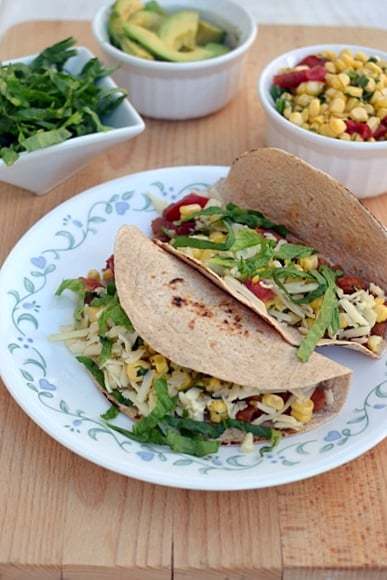 Vegetarian Tacos with Pinto Beans & Cheese Recipe | HeyFood — heyfoodapp.com