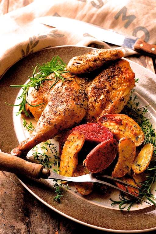 Herb and Garlic Roasted Chicken with Dijon Rosemary Roasted Fingerling Potatoes Recipe | HeyFood — heyfoodapp.com