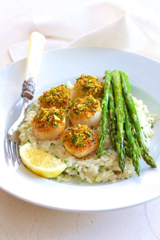 Pistachio Encrusted Sea Scallops with Champagne Risotto and Roasted Asparagus Recipe | HeyFood — heyfoodapp.com