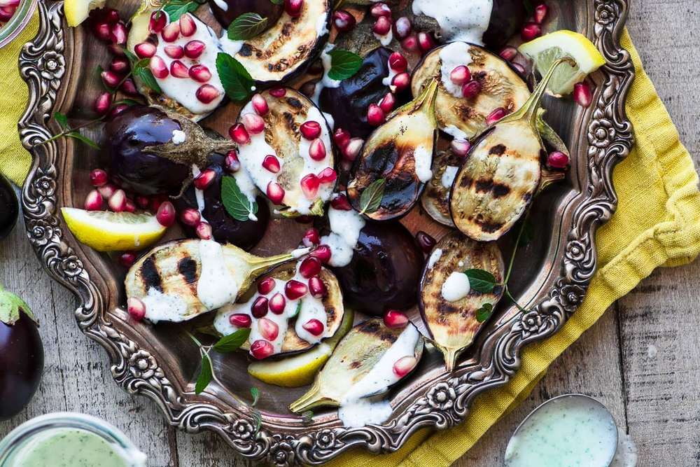 Grilled Baby Eggplant with Minted Yogurt and Pomegranate Recipe | HeyFood — heyfoodapp.com