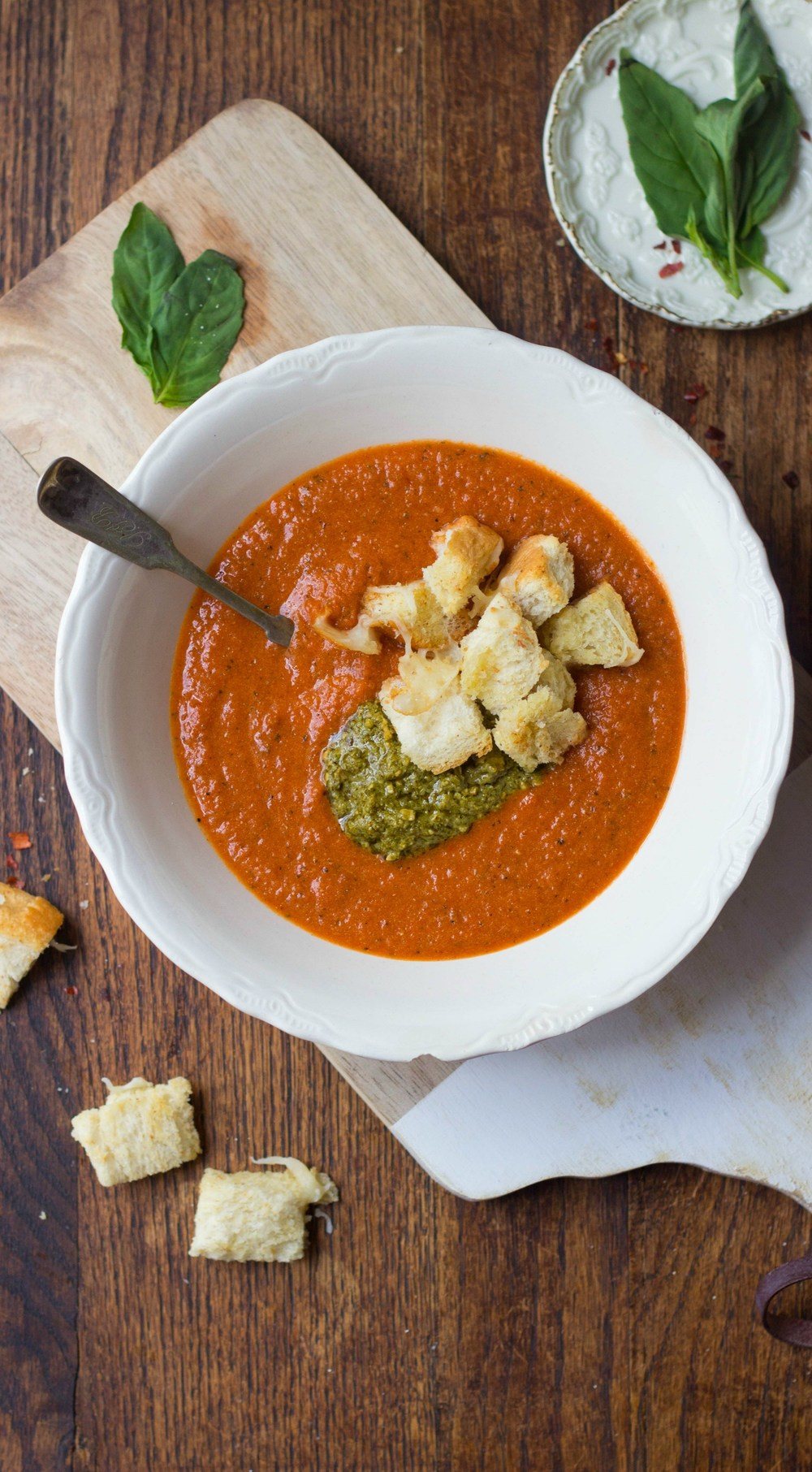 Tomato-Pesto Soup with Cheesy Garlic Bread Croutons Recipe | HeyFood — heyfoodapp.com