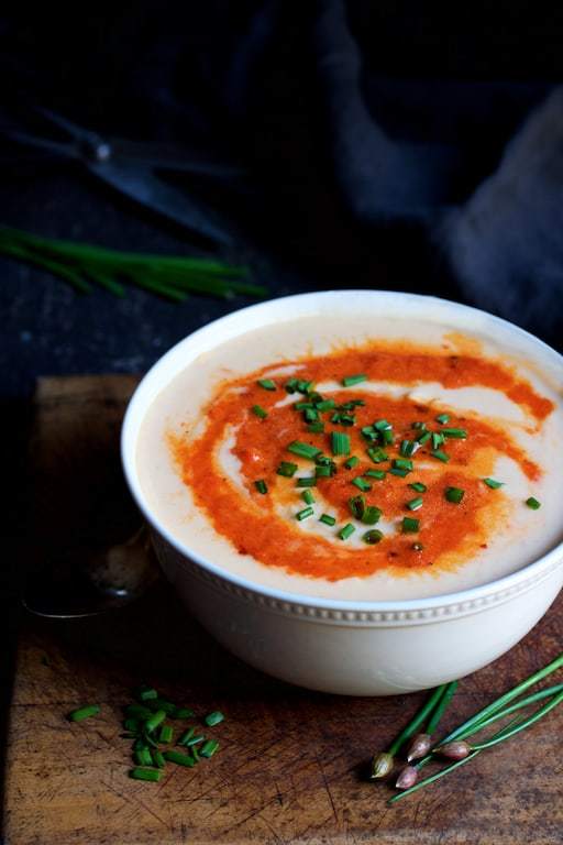 Creamy Cauliflower Soup with Gouda Cheese and Roasted Red Pepper Puree Recipe | HeyFood — heyfoodapp.com