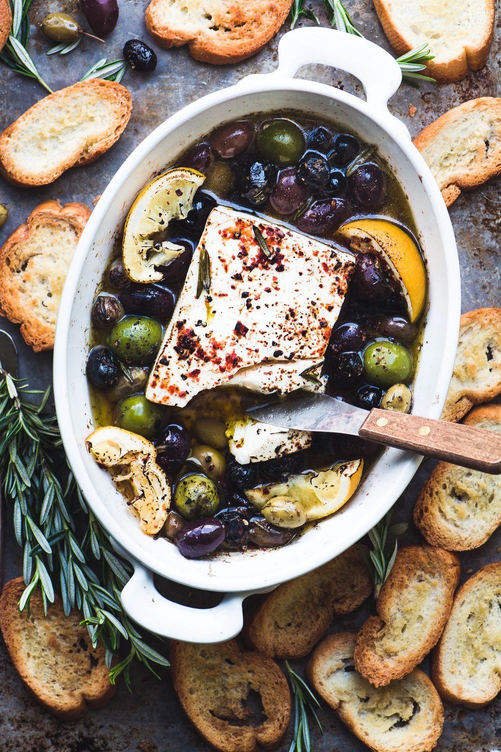 Baked Feta Cheese with Olives, Lemon and Rosemary Recipe | HeyFood — heyfoodapp.com