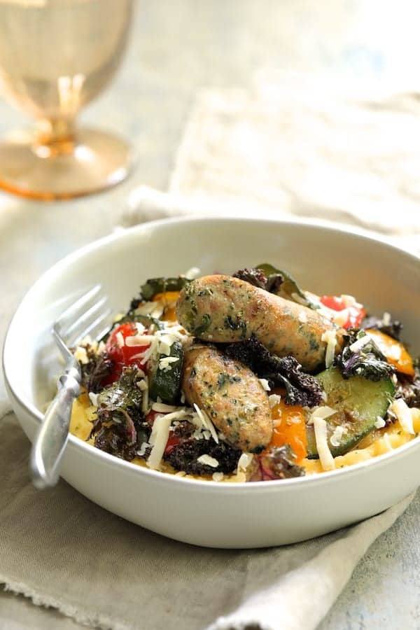Mediterranean Sheet Pan Chicken Sausage and Vegetables with Garlic Parmesan Polenta Recipe | HeyFood — heyfoodapp.com