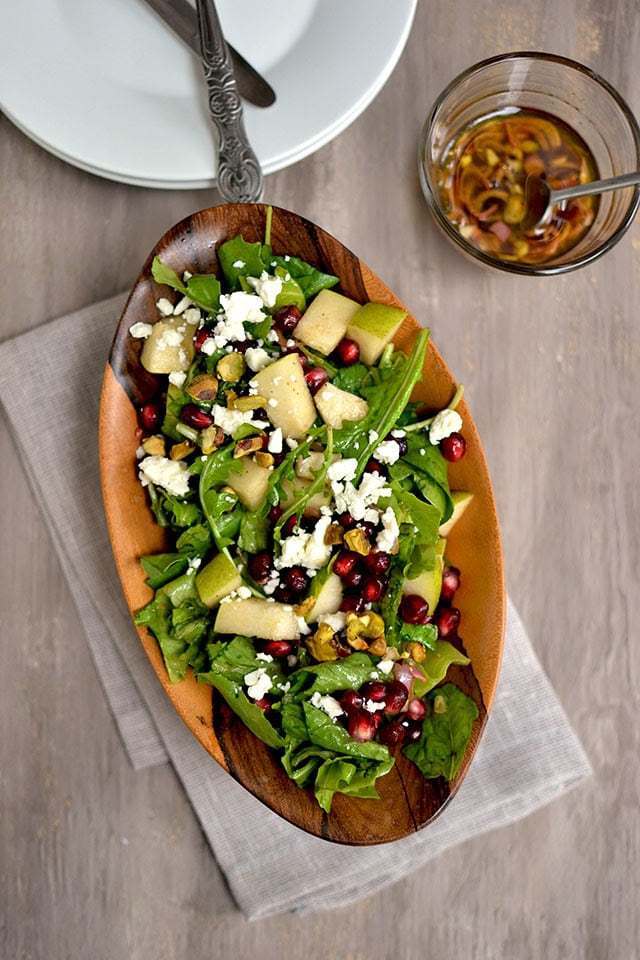 Arugula & Pear Salad with Pomegranate Vinaigrette Recipe | HeyFood — heyfoodapp.com